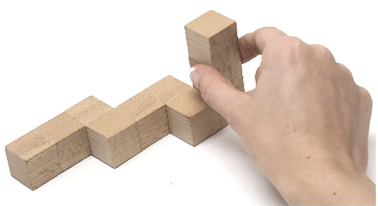 hand grasping irregularly shaped object